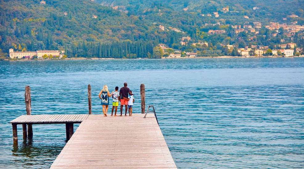 family on a pier by the sea